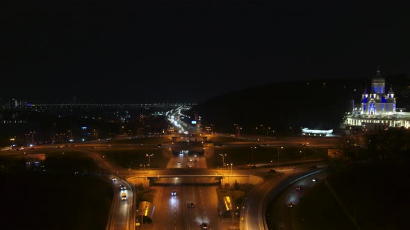Road Junction on the Bridge at Night Aerial View alt