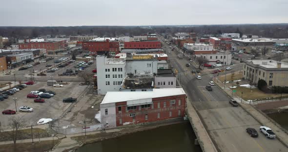 Owosso Michigan downtown skyline with drone videoing sideways. alt