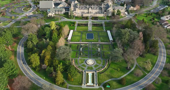 Huge English garden, fountain stone mansion estate. Aerial view in spring. alt