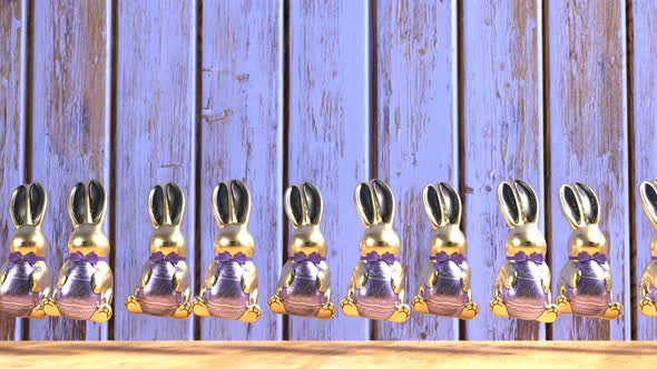 Loopable animation of cute chocolate jumping Easter bunnies.  Happy Easter. alt