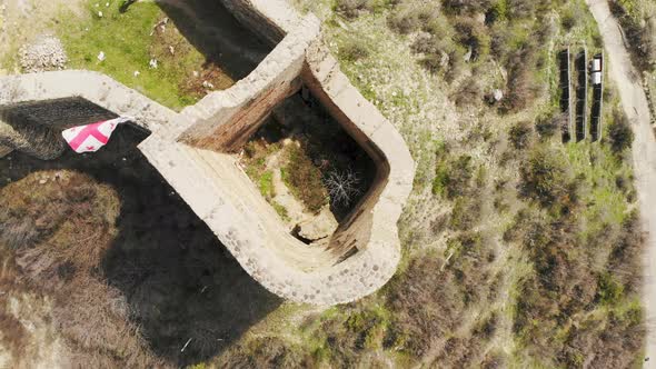 Overhead View Tourist Walking Around Old Georgian Fortress Ruins alt