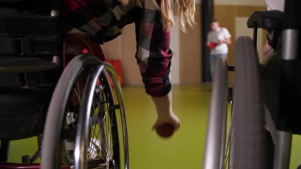 Hand of Bocce Player in Wheelchair Throwing Ball alt