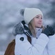 Portrait of an Attractive Blonde Woman Walking at Winter and Warming Up Hands 6K - VideoHive Item for Sale
