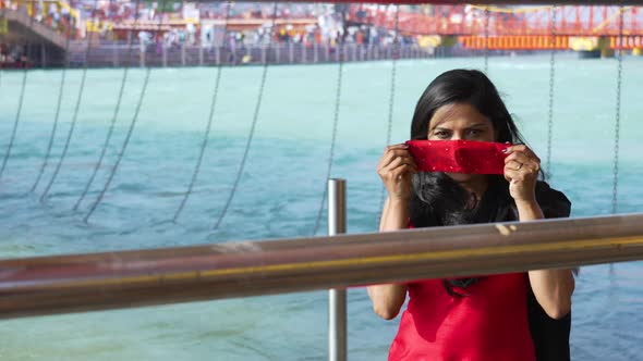 Indian Woman Wearing Coronavirus Protection Face Mask Holy River Ganges Flowing in Background