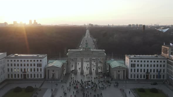 AERIAL: Over Brandenburg Gate with View on Tiergarten and Berlin Victory Column in Beautiful Sunset alt