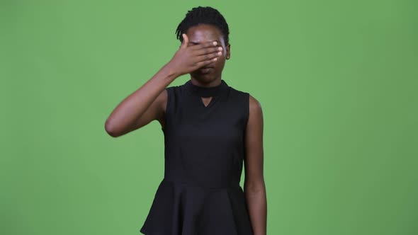 Young Beautiful African Businesswoman Covering Eyes As Three Wise Monkeys Concept