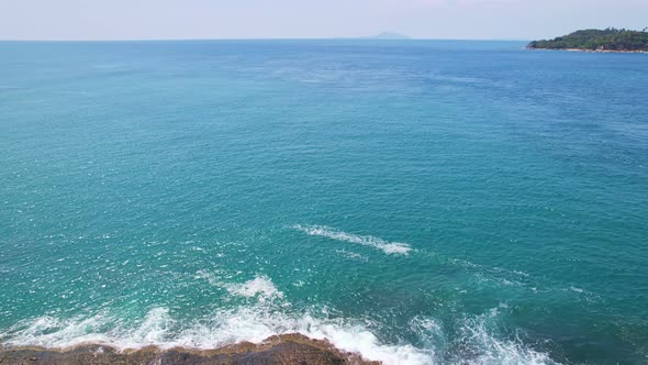 Aerial view phuket seashore Wave crashing on rocks at Laem promthep cape beautiful sea in Phuket alt