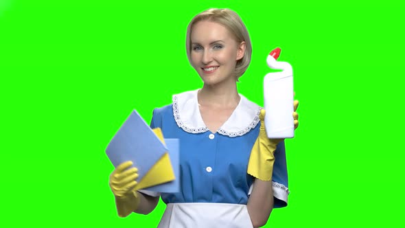 Woman with Toilet Cleaner Bottle and Napkins for Cleaning alt