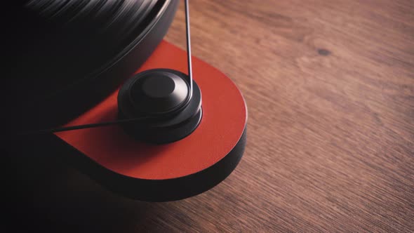 motor with a belt drive of a vinyl turntable. close-up. static frame. wooden table. alt