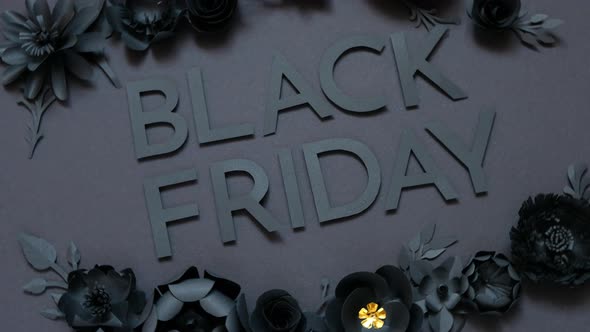 Black friday offer. Black paper flowers on Black background. Cut from paper. alt