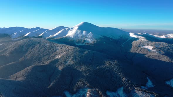 Aerial Winter view on Hoverla, peak of highest mountain of Ukraine. Winter Forest Snow Covered Trees alt