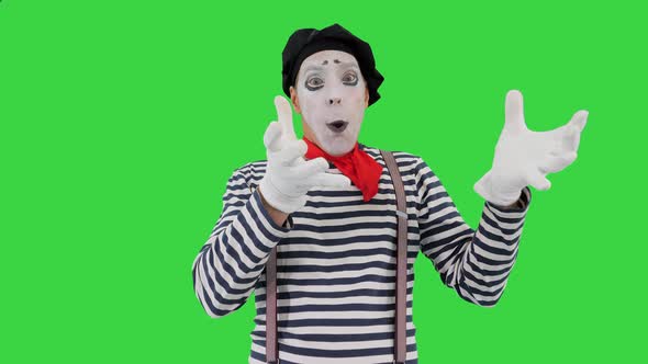 Mime Artist Blowing Imaginary Balloon on a Green Screen Chroma Key alt