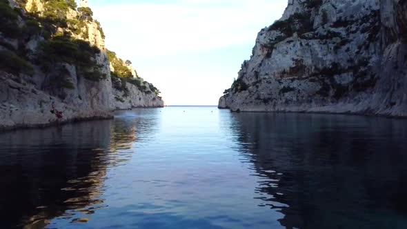 Flying over turquis water and revealing a crazy looking bay in france alt