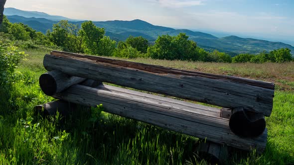 Bench On A Meadow In The Mountains On A Spring Sunny Day Hyperlapse alt