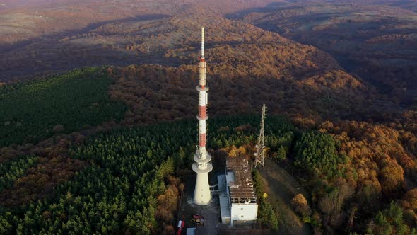 Tv tower on hill at sunset