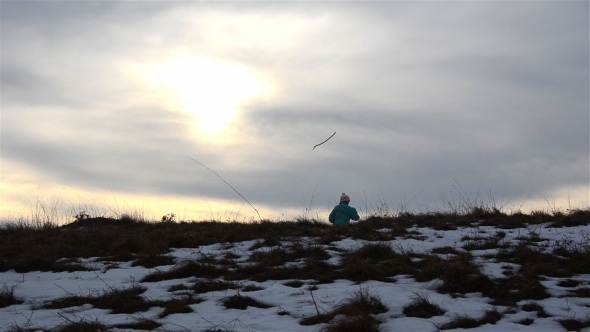 Child Playing in Sunset