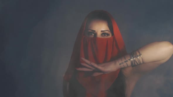 Woman Dancing in Smoke in Red Dress alt