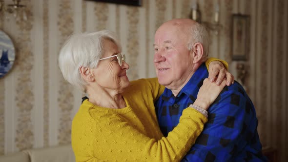 Never Stop Loving Each Other Cheerful Elderly Couple Hugginh Each Other Medium Closeup Indoor Senior alt