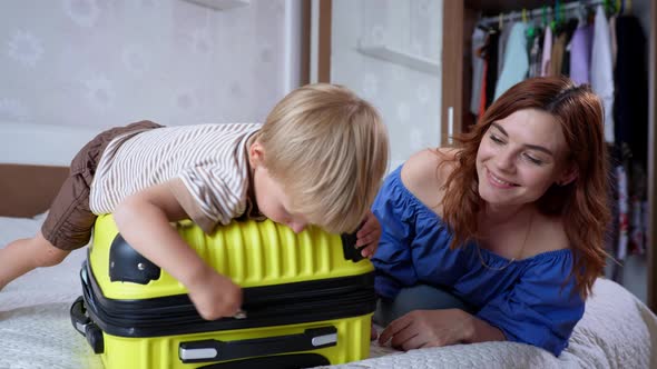 Summer Vacation, Little Cute Cute Male Child Has Fun with His Loving Mother and Enjoys Joint alt