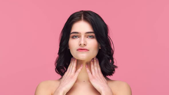Studio portrait of young and beautiful brunette woman. alt