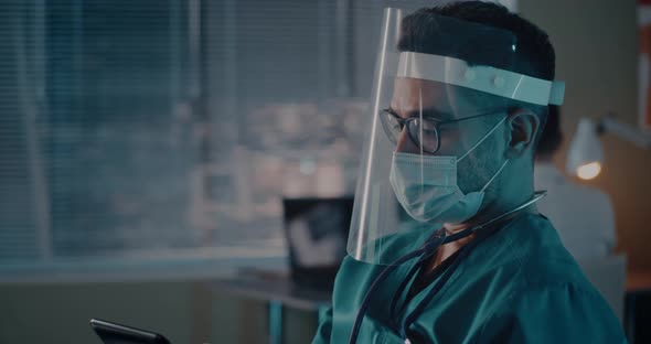 Medical Practitioner Using Tablet During Appointment alt