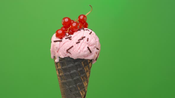 black cone with melting strawberry ice cream 