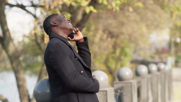 Phone Speaking Mobile Conversation Happy Man Park alt