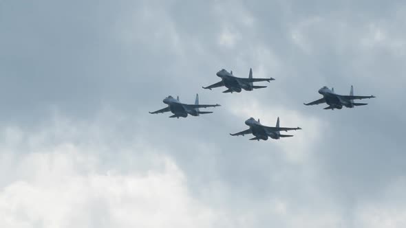 Four Su35 Airplanes Are Flying in the Sky in Slow Motion at an Military Airshow alt
