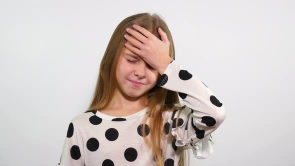 Girl Raises Her Hand to Forehead to Show that Something Forgot  alt