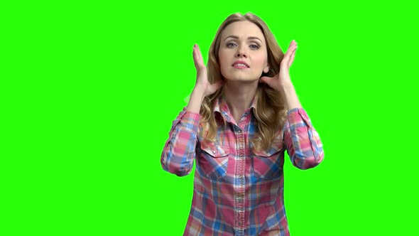 Young Attractive Woman Is Preening on Green Screen alt