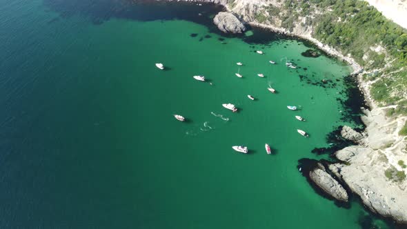Aerial Panoramic View of Seascape with Crystal Clear Azure Sea and Rocky Shores alt