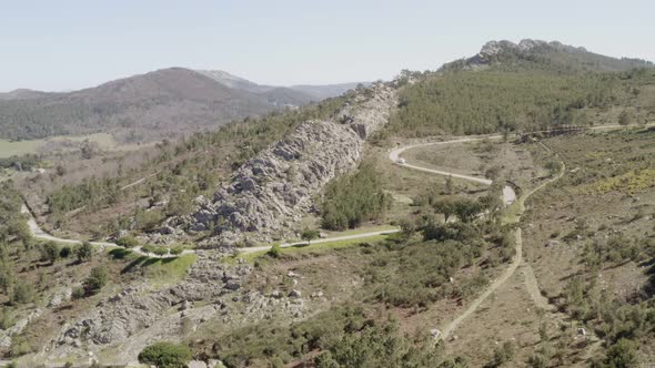 Aerial drone view of Serra de Sao Mamede in Castelo de Vide, Portugal with a camper van passing on t alt