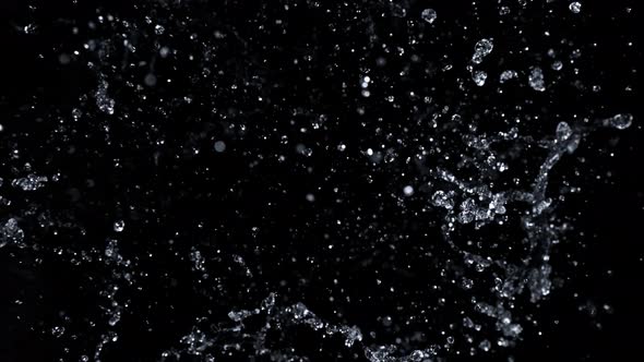 Super Slow Motion Shot of Abstract Water Splash Isolated on Black Background at 1000Fps alt