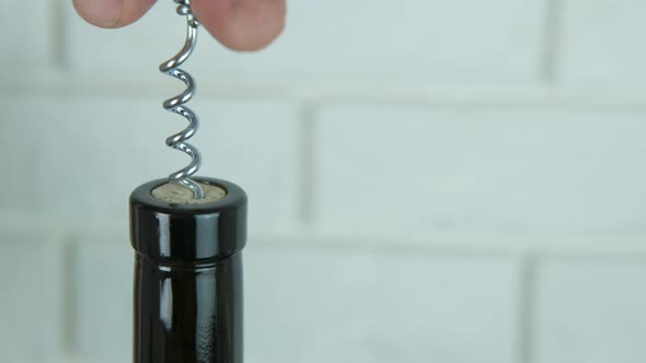 Uncorking a bottle.  alt