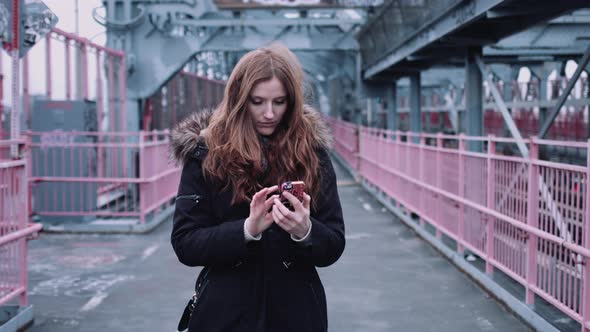 Young adult woman on street in New York taking selfie