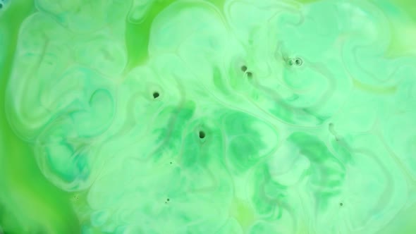  Footage. Ink in Water. Green Ink Reacting in Water Creating Abstract Background.