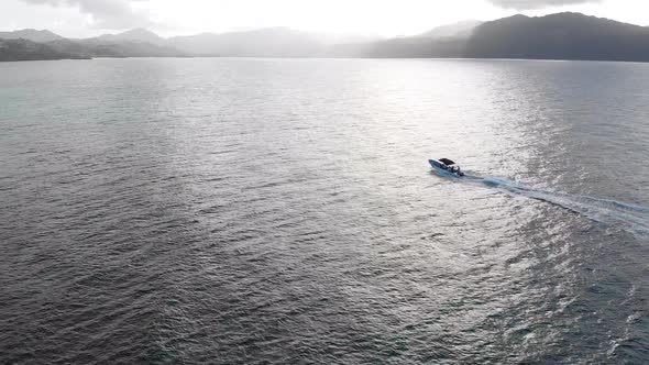 Ocean View With Mountains And A Boat