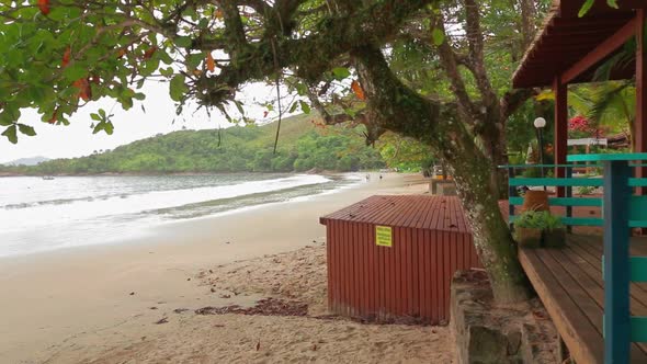 First person view of  wooden house surrounded by the beach and tropical trees. Real time. Fortaleza, alt