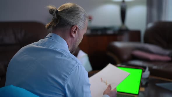 Stressed Troubled Caucasian Freelancer Analyzing Paperwork Throwing Away Diagrams Leaning with alt