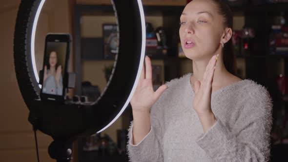 Pretty Beauty Coach Practicing Face Yoga, Shows Skin Massage Lines, Online Class