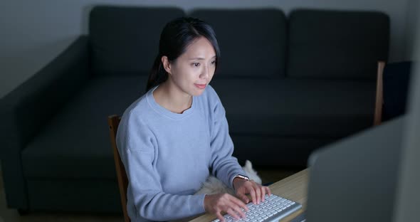 Woman use of computer at home alt
