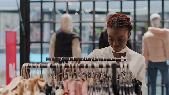 Young Beautiful Stylish Shopper Female Consumer African American Woman Girl Looking for Perfect alt