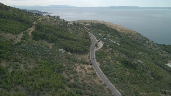 Drone View of a Mountain Road in the Makarska Riviera Region in Croatia with a Stunning Adriatic