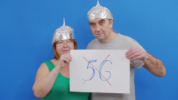 Man and Woman Are Holding Placard with No 5g Sign. Protesting Against 5G Technology and 5G alt