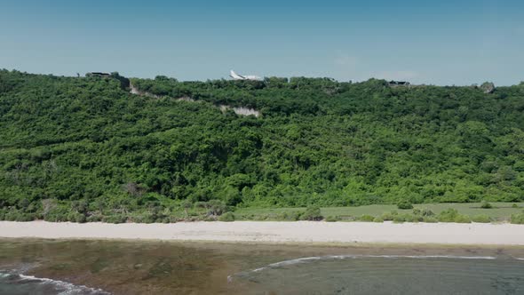 Amazing Tropical Paradise Near the Ocean with Airplane on Edge of Cliff in Green alt
