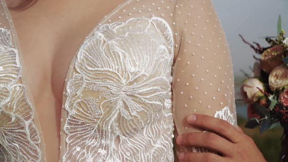 The Groom Gives the Bride in a White Dress Beautiful Wedding Bouquet alt