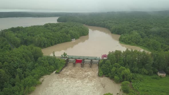 Aerial View of the Dam During Floods. Extremely High Water Level in the River.