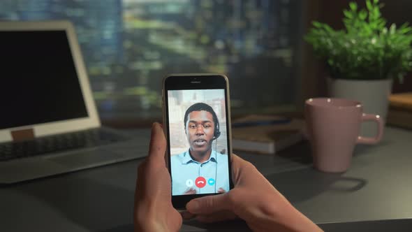 Video Call to the Black Business Partner on Smartphone alt