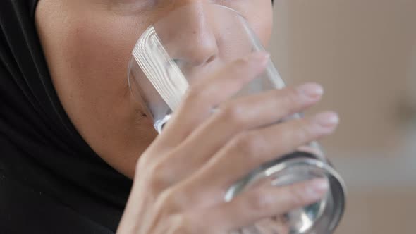 Happy Muslim Young Girl in Hijab Drinking Pure Mineral Water Hydrating Thirst Enjoy Refreshing Taste alt
