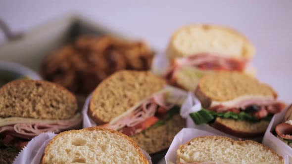 Step by step. Fresh sub sandwich on white and wheat hoagies. alt